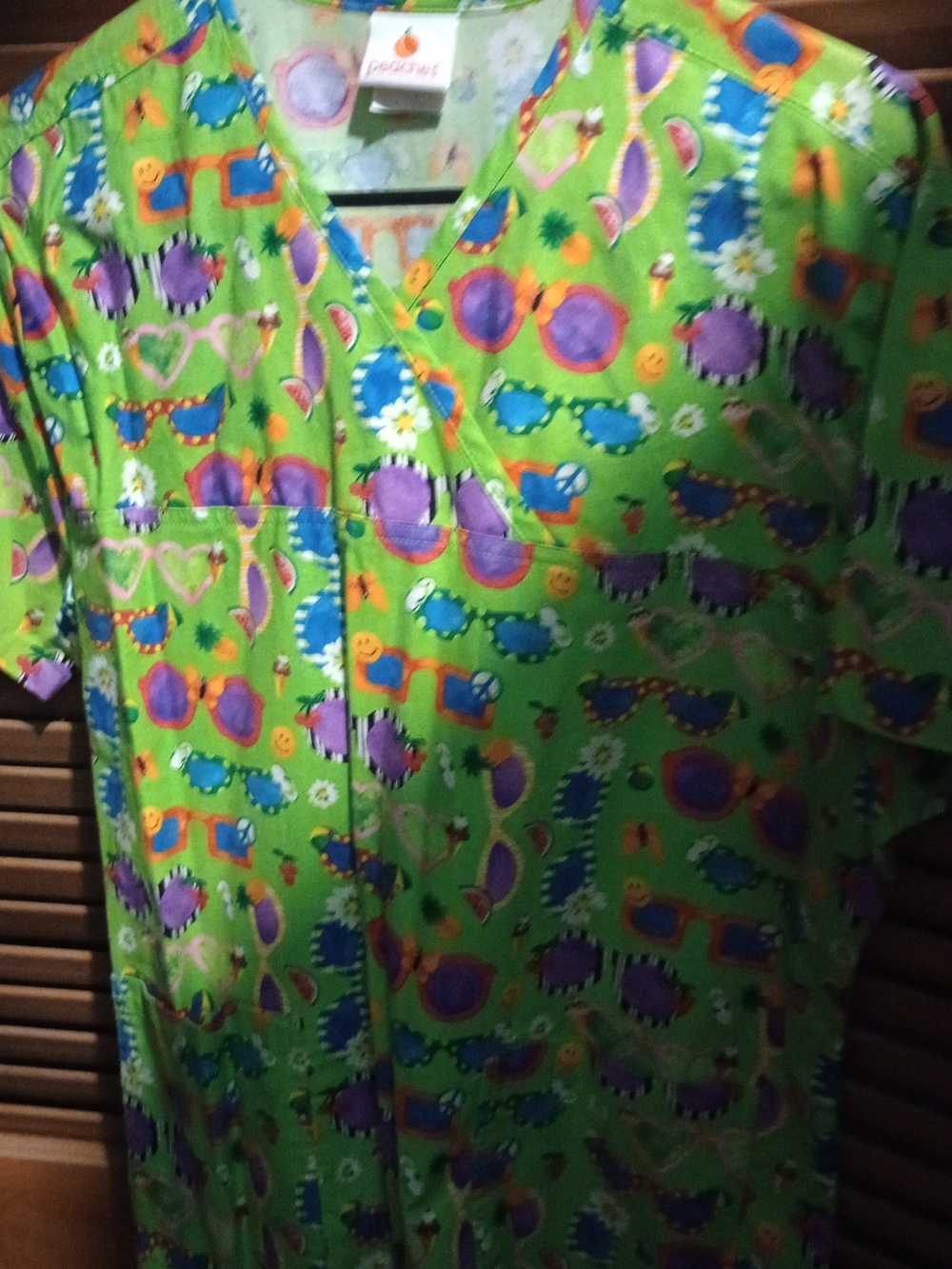 Peaches Uniforms Green Scrub Top with Purple and Blue Sunglasses Print